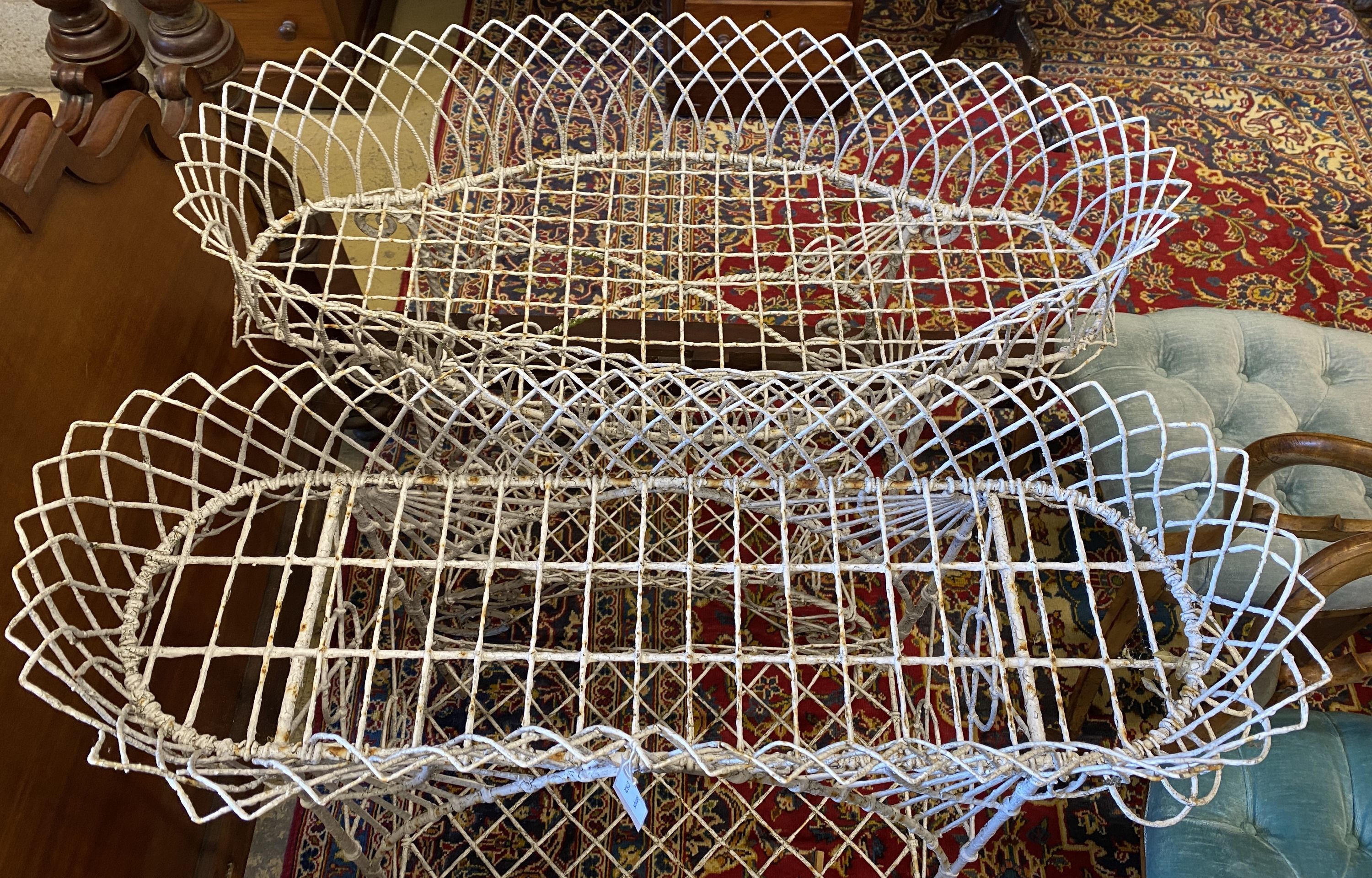 Two Victorian two tier wirework pot stands, larger width 84cm, height 94cm
